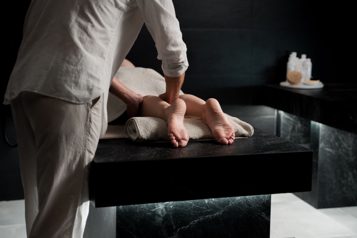 Therapist giving a foot massage at a spa in Dubai